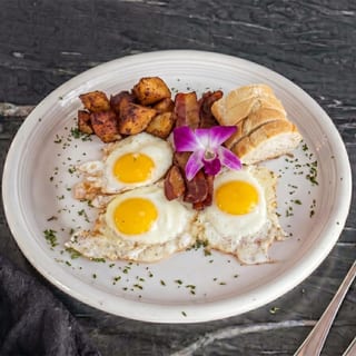 3 Eggs, Baguette, Bacon, Homestyle Potatoes, and Brewed Coffee