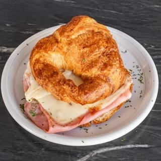 Croissant Egg, Ham and cheese with house potatoes