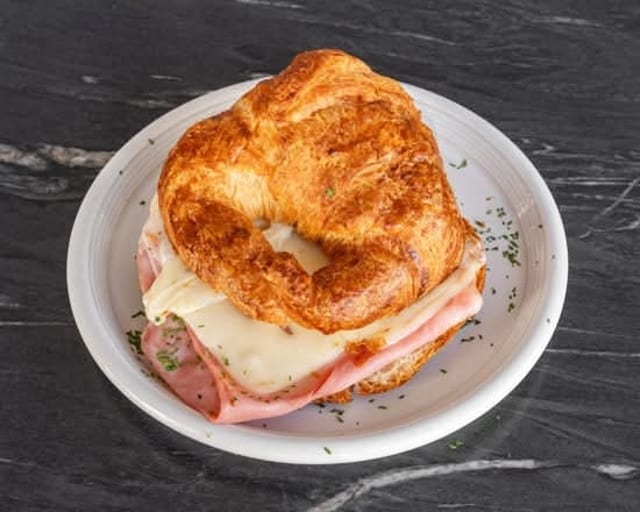 Croissant Egg, Ham and cheese with house potatoes.